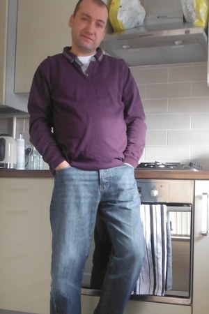 purple shirt and blue jeans