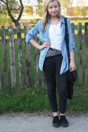 sky blue shirt and black jeans